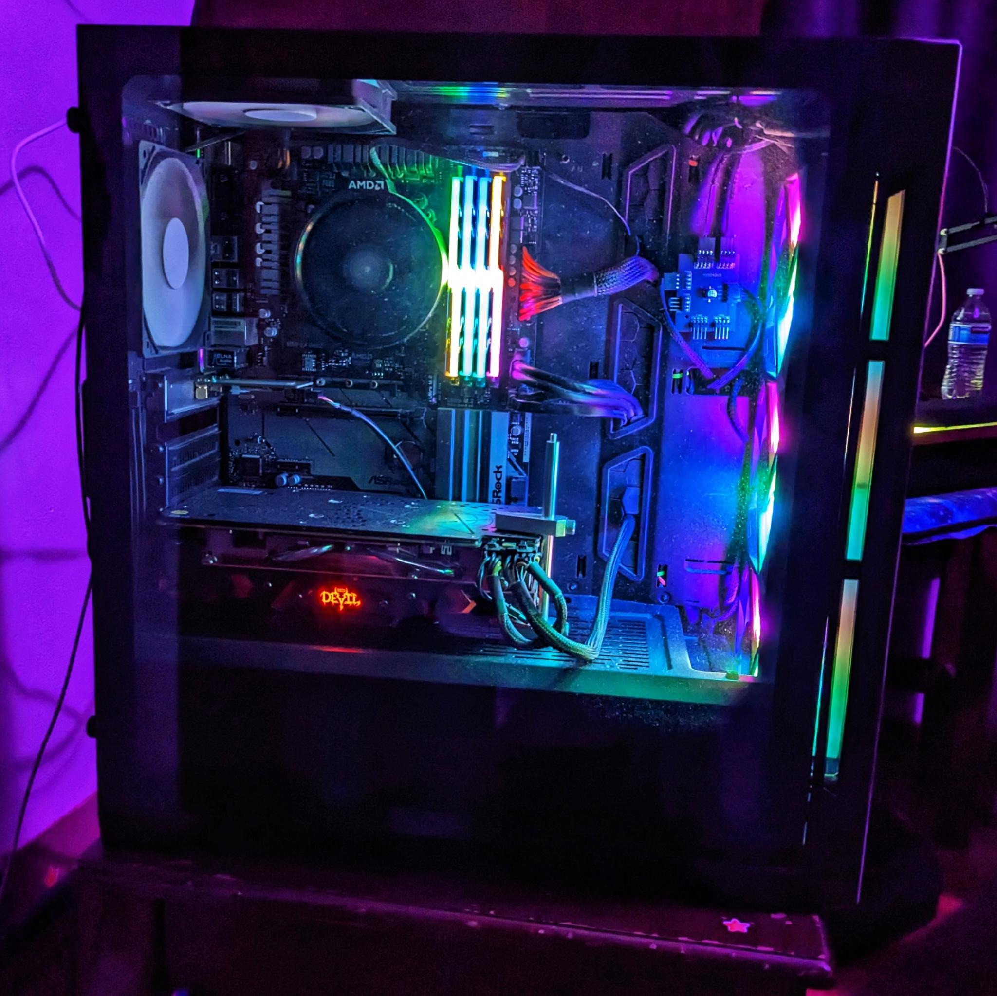 a mid-sized PC tower with a side window to show glowing RGB fans & RAM